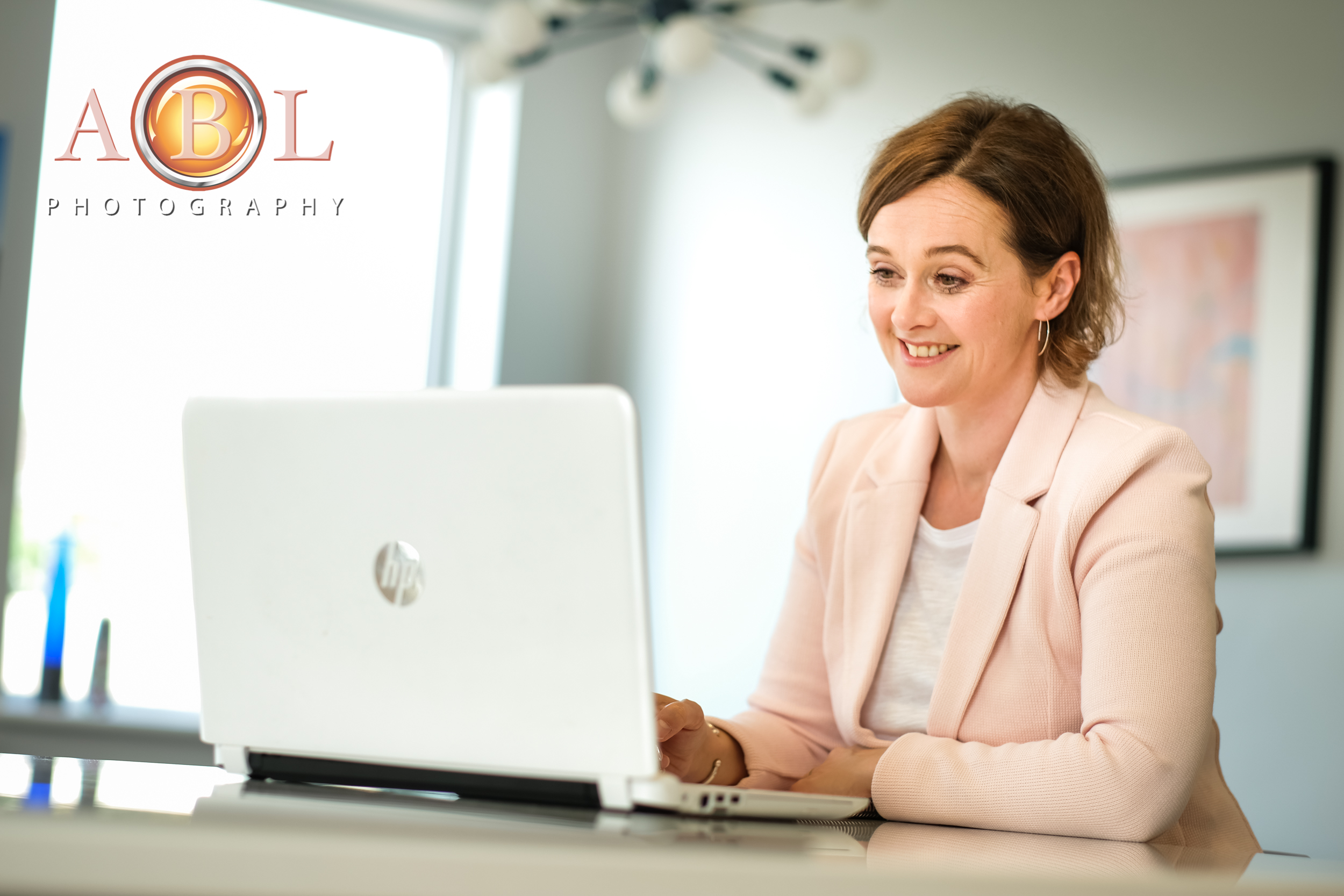 Business Branding Photo-Shoot - a Coach with a laptop