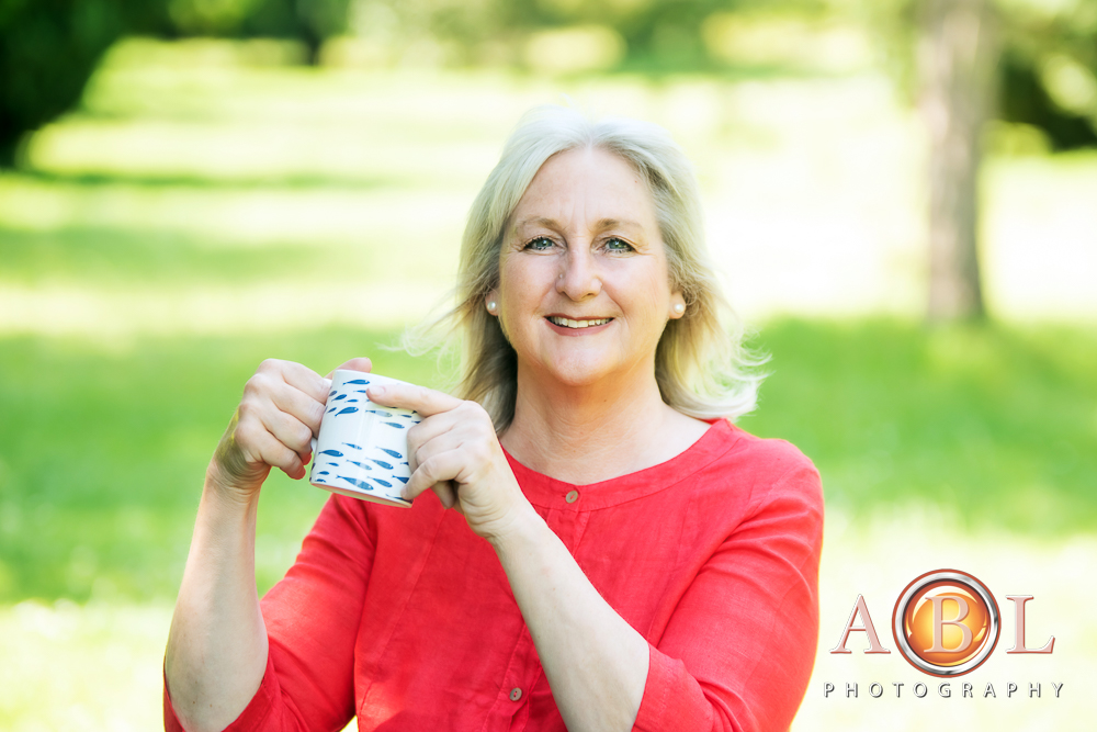 lady in red holding a mug