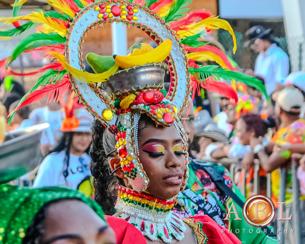 Baranquilla carnival - lady with a feather and fruit headpiece